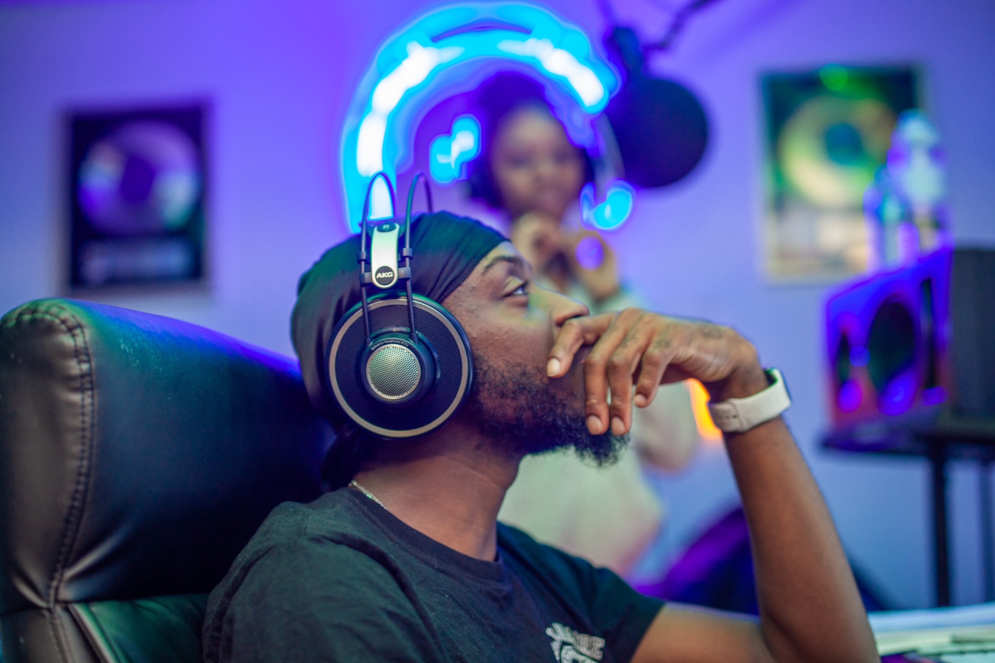 Audio engineer listening on headphones in the Sounds of Tomorrow studio