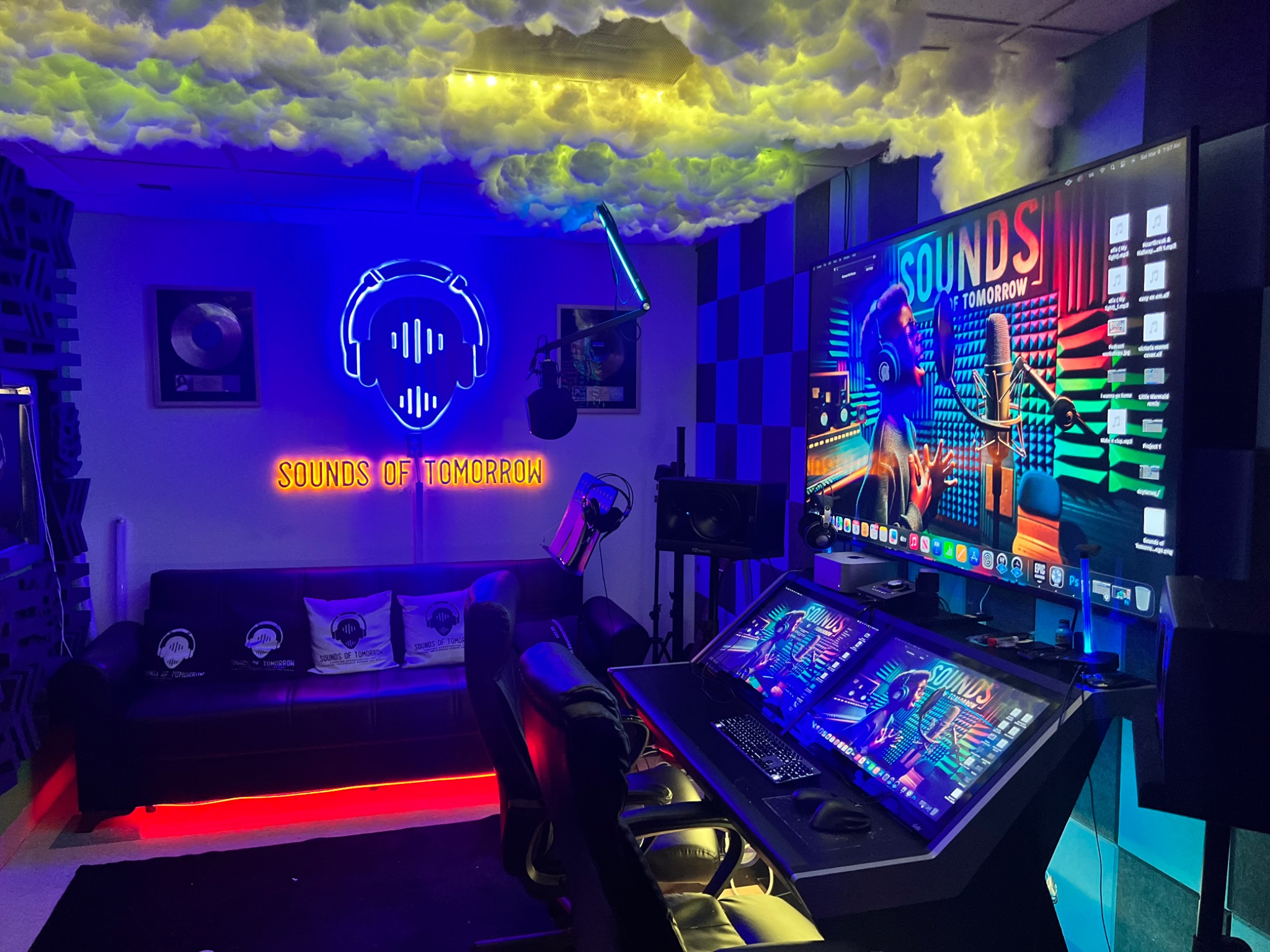 Sounds of Tomorrow recording studio with illuminated logo and production workstation